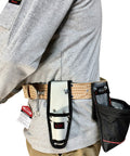 Man wearing 2 inch wide heavy duty leather scaffold tool belt with pronged roller buckle, fits 44 to 54 inch waist, durable beige.
