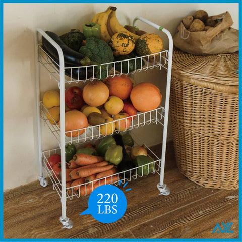White three-tier metal rolling cart on caster wheels, loaded with oranges, apples, peppers, and other produce.