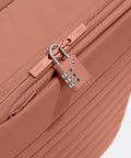 Close-up of Softside Bigger Carry On Luggage 23 Inch Expandable with TSA color matching padlock in cloud gray.