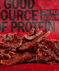 Original Beef Jerky Half Pounder Made With 100 Percent Real Beef Ready To Eat Protein Snack With 10g Per Serving In An 8 Oz Large Bag For Lunches And Outdoor Adventures shown with beef jerky pieces and 10g protein label