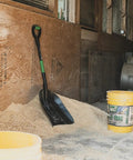 Scoop Shovel With Lightweight Aluminum Head Ergonomic No Slip H Grip D Handle And Fiberglass Core leaning on sand pile