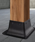 Close-up of Beefy 4x4 Post Bases with Brackets Anchoring a 3.5x3.5 Wood Post, powder coated steel, for decks and porches.