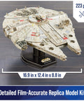 Millennium Falcon 3D Model Kit For Star Wars Fans And Collectors shown assembled on stand, 223 pieces, 16.9 x 12.4 inches