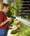 Woman using Durable ABS Garden Hose Nozzle With Seven Adjustable Sprays for plant watering in a garden, showcasing spray pattern.