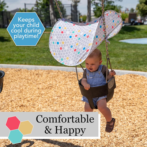 Outdoor Baby Swing Sun Shade For Toddlers, Portable Folding Canopy That Blocks UV Rays, Easy Install, Lightweight And Durable UV Resistant Top, Fits Most Outdoor Swing Sets, Keeps Your Lil One Cool During Play showing a baby swinging under a polka dot canopy in a playground.