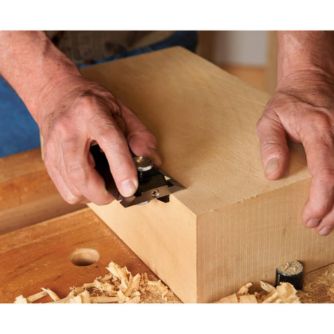 User demonstrating Heavy Duty Precision Side Rabbet Plane For Serious Makers Featuring Rock Solid Steel Construction T10 Sharp Blades And Dead Nuts Accurate Depth Control Total Shop Essential in woodworking.