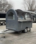Premium Fully Equipped Food Trailer With Complete Mobile Kitchen Setup Designed For Street Vendors And Festival Catering exterior rear view with gray finish and awning.