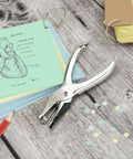 Three Pack Single Hole Punch Pliers Set With 10 Sheet Capacity, silver finish, shown with paper crafts and punched holes
