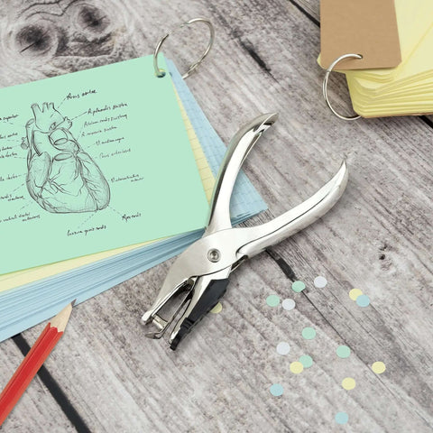 Three Pack Single Hole Punch Pliers Set With 10 Sheet Capacity, silver finish, shown with paper crafts and punched holes