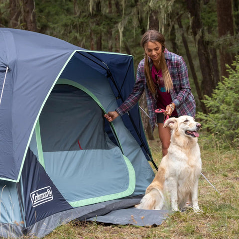 Skydome Camping Tent With Five Minute Setup Weatherproof 2, 4, 6, And 8 Person Shelter With Rainfly features a woman and dog outdoors
