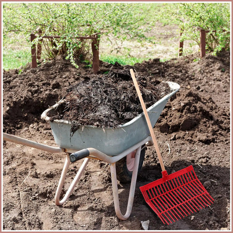 Wheelbarrow filled with manure next to red rake with Six Piece Set Of Manure Fork Replacement Heads Red With 18 Tines Screws And Nuts