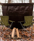 Heavy Duty Poly Tarp Cover Built Tough With 16 Mil And 10 Mil Thickness Grommets And Reinforced Edges True To Size 20x20 Ft All Weather Outdoor Tarp In Brown White Silver Black For Rain Wind Snow UV, set behind green chairs in a forest setting.
