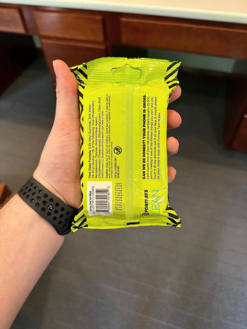 Back view of To Go Tech Wipes 25 Count Skin Safe Electronics Cleaning Wipes pack held in a hand