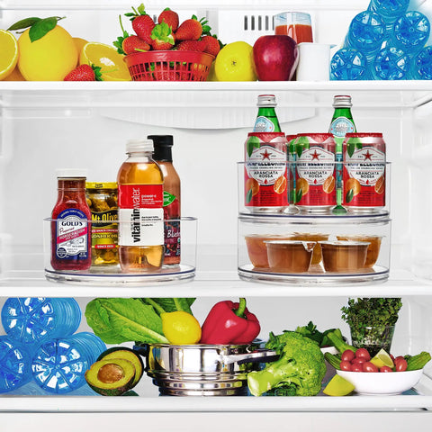 Clear 9 Inch Lazy Susan Organizer Turntable For Spice Cabinet Storage And Kitchen Organization Go To Multipurpose Lazy Susan For Home Office Closet Classroom Or Laundry Room 2 Pack in fridge holding beverages and jars.