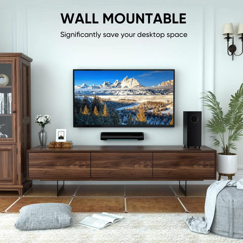 Living room setup with wall-mounted TV and 2.1 Channel Sound Bar With Subwoofer For TV And PC Gaming Kickin Bass For Movie Night Deep Bass Home Theater System With Bluetooth AUX Optical Wall Mountable 17 Inch Immersive Surround Sound