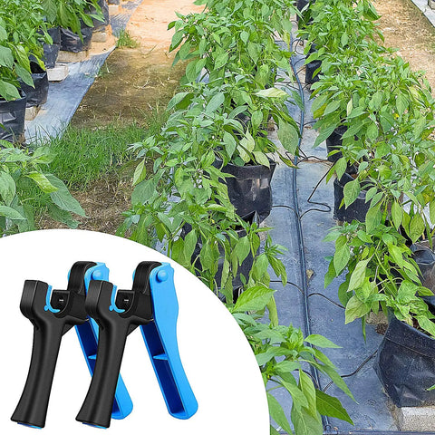 Irrigation Tubing Hole Punch Tool For One Quarter Inch Fittings And Emitter Insertion with pepper plants in garden setup