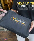 Person holding FightTech branded pouch for Rugged Leather Welding Apron With Eleven Tool Pockets For Woodworking And Metalworking