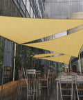 Outdoor cafe with 12 Ft By 12 Ft By 12 Ft Beige Triangle Sun Shade Sail Waterproof UPF50 Plus Water Resistant Outdoor Canopy