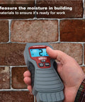 Hand using 7440 AccuMASTER XT Digital Moisture Meter Handheld Pin Type With Backlit LCD Display on brick wall