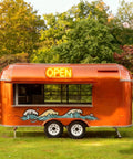 Turnkey Commercial Hot Dog Cart And Mobile Food Truck Trailer For Quick Bites Or Soft Serve With Pro Coffee Bar Setup and Rock Solid Wheels in orange.