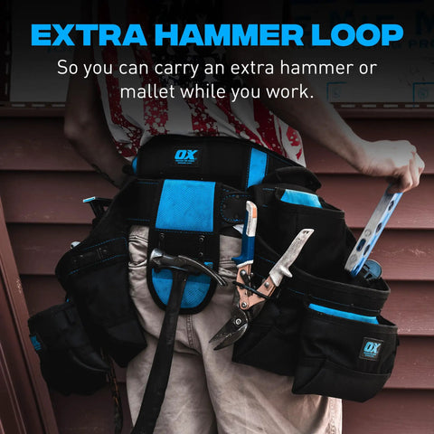 Man wearing nylon framing tool belt with padded back, extra hammer loop, and PVC pouches for carpenters and electricians.