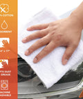 Hand using Bulk Terry Cloth Cleaning Rags 300 Pack, 14x17 Inch 100% Cotton Towels on car headlight