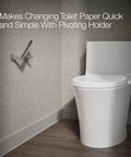 Purist Toilet Paper Holder In Polished Chrome, Pivoting For Quick Roll Changes, shown installed in modern bathroom