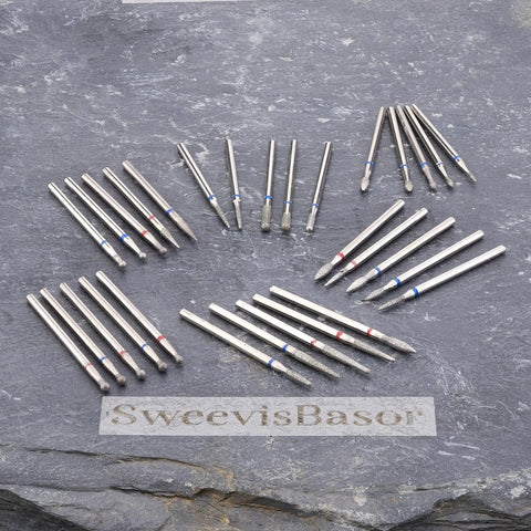 Pro Grade Nail Drill Bits Set For Pedicure And Cuticle Care With Diamond Grit 120 shank burrs arranged on a slate surface