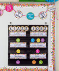 Bulletin board with class jobs chart and confetti design name tags for classroom use organizing learning centers.