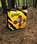 Yellow Jacket Archery Target Bag Portable With Dual Sides And Ten Bullseyes outdoors on forest ground with black stripes
