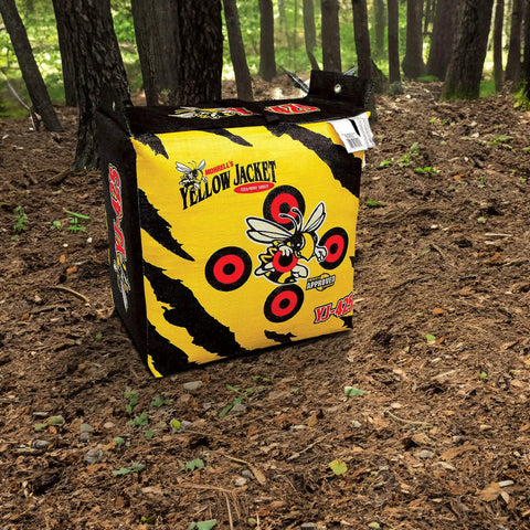 Yellow Jacket Archery Target Bag Portable With Dual Sides And Ten Bullseyes outdoors on forest ground with black stripes