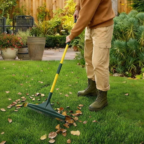 Person using Beefy Turf Rake With Steel Telescopic Handle, Adjustable From 32 To 55 Inches on artificial grass.