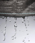 Water seeps through Heavy Duty Woven Weed Control Fabric 6 by 33 Feet Black Ground Cover Membrane Lets Water and Air Through While Blocking Sunlight to Stop Weeds in Gardens and Lawns 3 Oz Per Square Yard