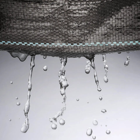 Water seeps through Heavy Duty Woven Weed Control Fabric 6 by 33 Feet Black Ground Cover Membrane Lets Water and Air Through While Blocking Sunlight to Stop Weeds in Gardens and Lawns 3 Oz Per Square Yard