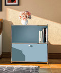 Front view of 32.5 Inch Flip Top Side Table With Detachable Wheels And Large Storage, Buffet Cabinet, Corner Bookshelf, Wall Shelf, Cube Organizer And Bedside Table For Modern Home Decor In Blue placed in living room.
