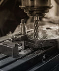 Close-up of annular cutter in a magnetic drill press cutting metal.