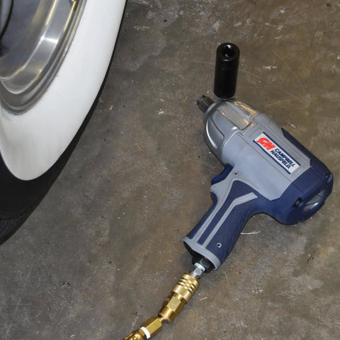Half Inch Pneumatic Impact Wrench With 750 Ft Lbs Torque Three Speed Regulator shown near car wheel for lug nut removal