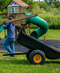 Heavy-Duty ATV UTV Utility Trailer With 1500 Lb Capacity, 22 Cu Ft Poly Tub, hauling wooden beam in backyard