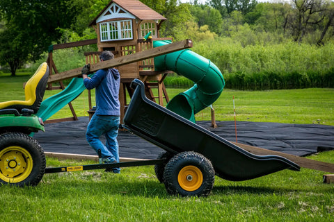 Heavy-Duty ATV UTV Utility Trailer With 1500 Lb Capacity, 22 Cu Ft Poly Tub, hauling wooden beam in backyard