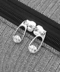 Close-up of zipper on Newcastle 15 Inch Underseat Luggage with black white herringbone pattern