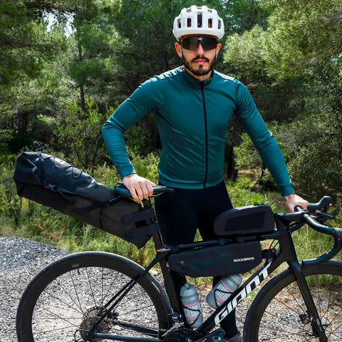 Cyclist with Adjustable 14L Waterproof Bikepacking Saddle Bag for Road and Mountain Bikes with Roll Top Closure Foldable Design