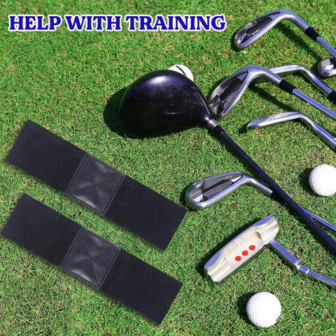 Two Pack Elastic Golf Swing Trainer Band For Beginners on grass with golf clubs and balls, black band 33 cm x 8 cm size