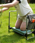 Person using Two In One Garden Kneeler And Seat Bench Foldable Workseat with EVA Foam Pad and Detachable Tool Pouch for gardening