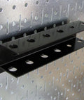 4-Foot Metal Pegboard Tool Organizer Kit With Galvanized Toolboard And Black Accessories, close-up of mounted slotted shelf.