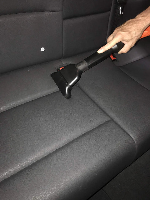 Using Central Vacuum Garage Attachment Kit With 50 Ft Hose, Crush Proof Pro Grade, tool on car seat.