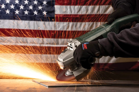 Worker using Long Life All Purpose Grinding Wheel Type 27 Depressed Center for Ferrous Metals with sparks flying