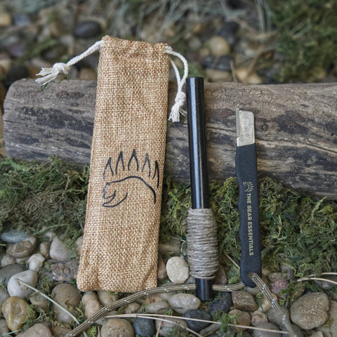 Prepper-Ready Large 6 Inch Ferro Rod With Tungsten Carbide Striker And Sharpener, Reflective Paracord on moss and rock background.
