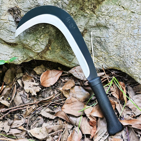 Beast Mode Machete Sickle For Weed Removal And Grass Clearing With Magnetic Long Handle and carbon steel blade on forest floor
