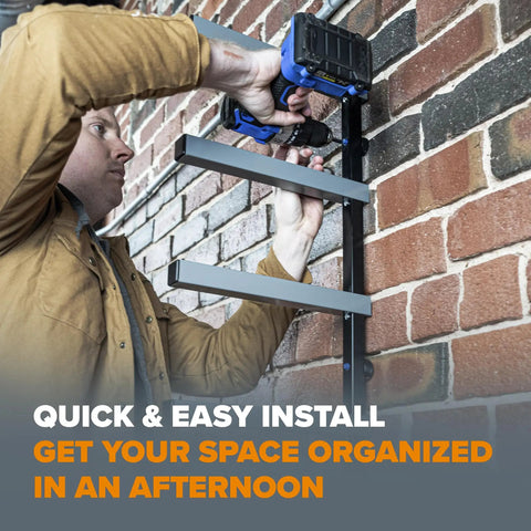 Person installing Garage Ready Six Level Wood Organizer And Lumber Storage Metal Rack on brick wall using a drill.