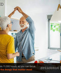 Elderly couple dancing in well-lit kitchen under LED Light Bulb 60W Equivalent A19 Four Pack, 8.5W Efficient Daylight Frosted 800 Lumens